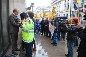 2012-12-21 12.08.18 Activist dressed as GCM executives is arrested as demonstration rages - demo pic by Samarandra Das