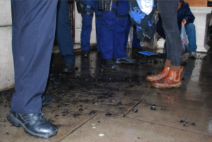 Police stand in coal covered doorway - demo picture 20 Dec 2012 by Samarandra Das