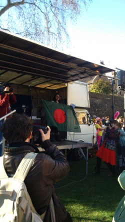 Rumana Hashem of Bangladesh National Committee and Phulbari Solidarity Group waves Bangladeshi flag to cheer up the protesters. Photo credit: Paul  V. Dudman 