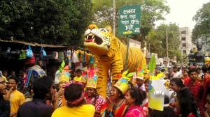 green cultural activists at samageet brought in a a procession with a royal bengal tiget on Bangla New year 2016