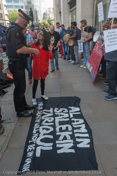 Police objects to PSG Founder Rumana Hashem to remove the banner from the pavement copyright Peter Marshall